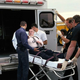 Illustration for article titled Man On Gurney Has Brief Word With Protagonist Before Entering Ambulance